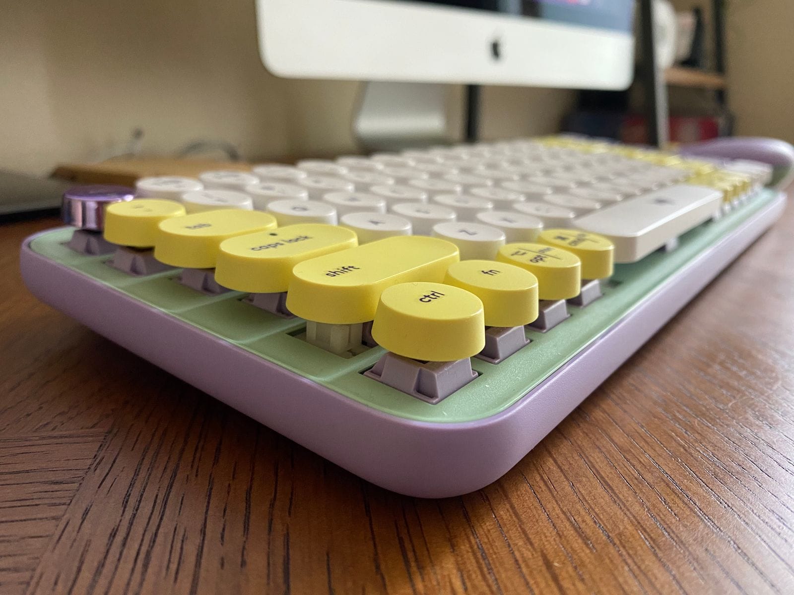 Logitech POP Keys keyboard on a wooden desk