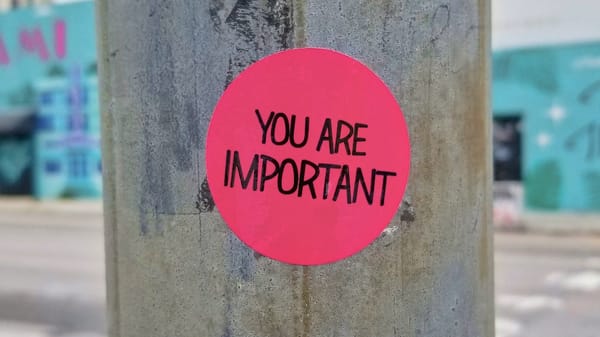 Sticker on a lamppost that says you are important
