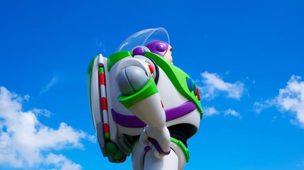 Buzz Lightyear from Pixar's Toy Story franchise staring up at a blue sky